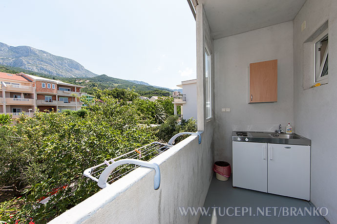 mini kitchen on balcony with view on mountain Biokovo