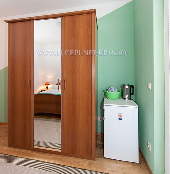 wardrobe, dressing mirror, refrigerator, water kettle