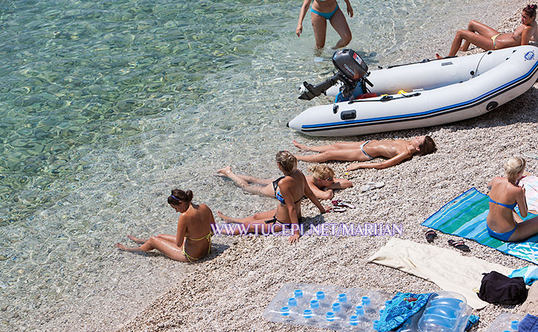 girls sunbathing on the beach in front of hotel Jadran, Tučepi