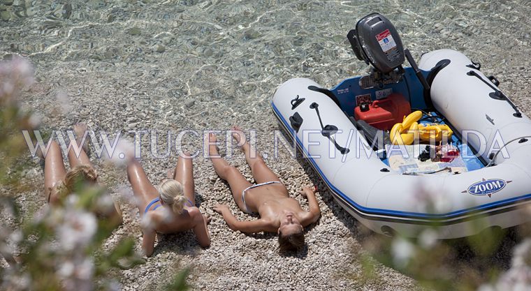 Girls sunning on the beach in Tučepi