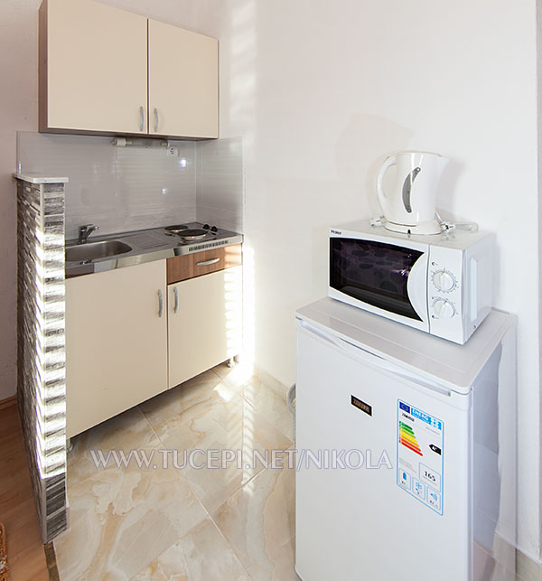 kitchen with microwave oven and coffeee maker