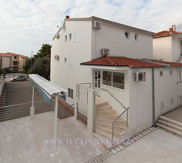 entrance to the apartment, parking place, terrace