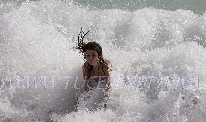 Tučepi - girl playing in the sea waves